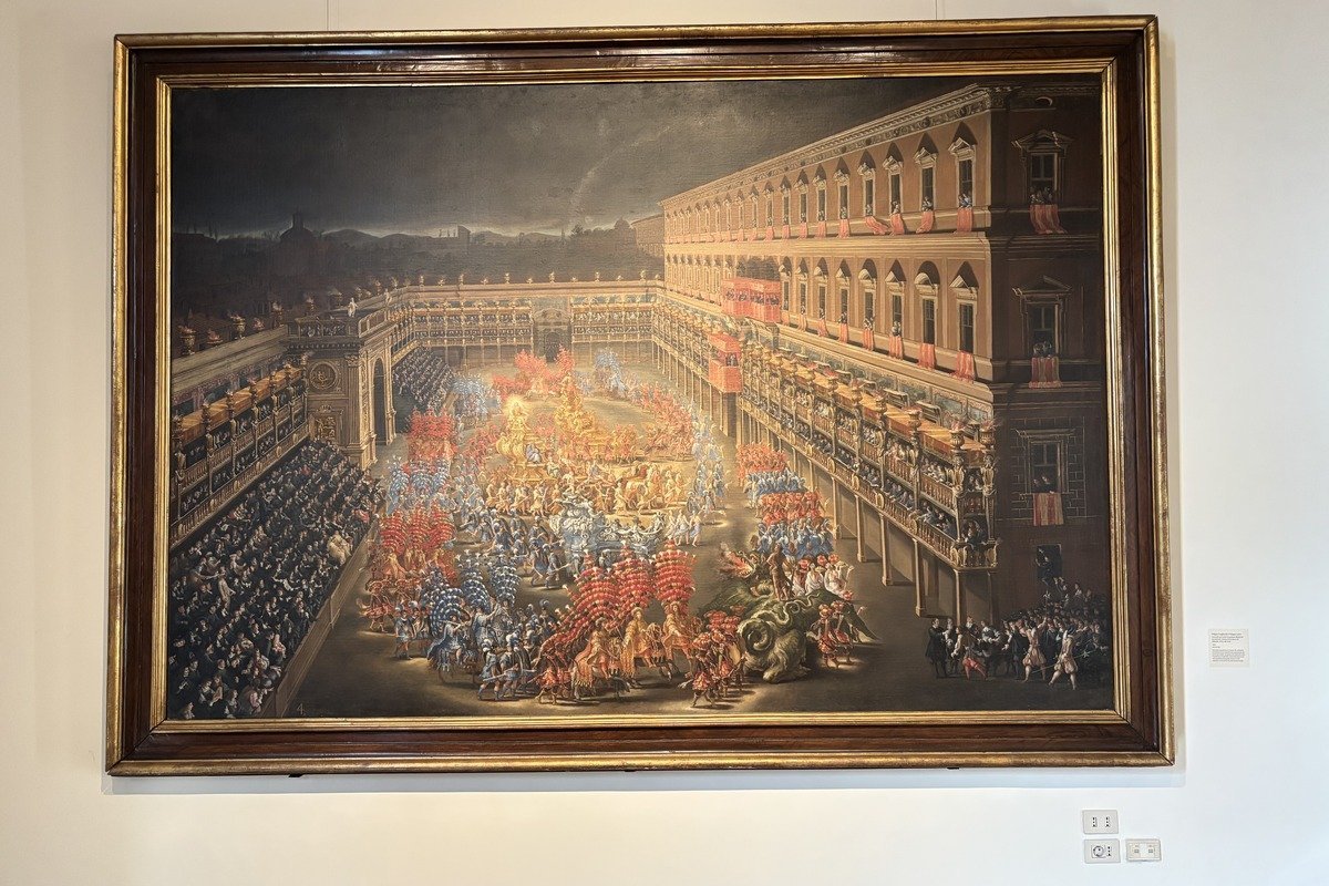 Grand tableau ancien représentant une fête populaire sur une place animée