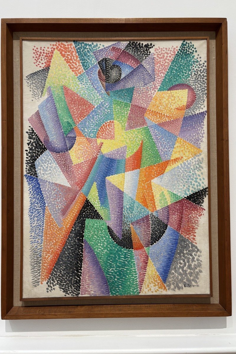 Tableau futuriste aux formes géométriques colorées dans un cadre en bois